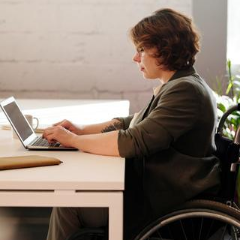 woman on laptop in wheelchair